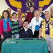 Timothy, surrounded by family, is honored by Gwinnett Lions Clubs
